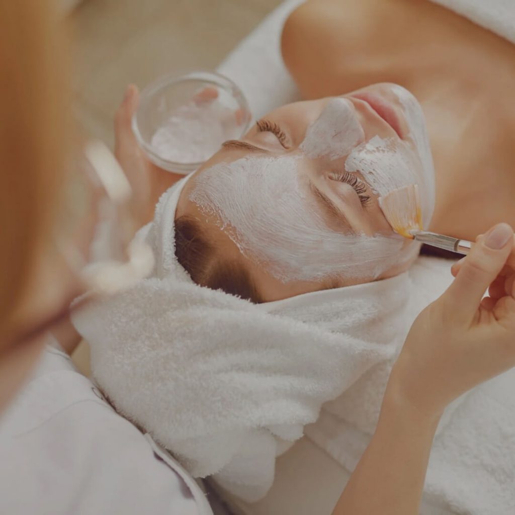 Putting on a facial mask